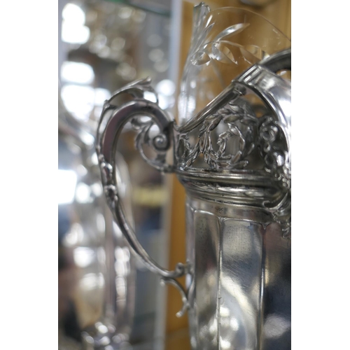 179 - Pair of Kaiser silver plated vases, circa 1910, each having a cut and shaped glass liner, with twin ... 