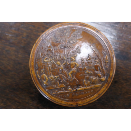 580 - Pressed burr wood circular snuff box, 19th Century, the cover decorated with a scene of revellers, t... 