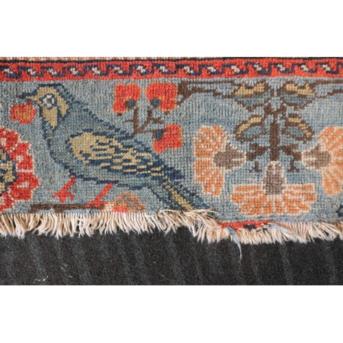 670 - Persian Malayer woollen rug, late 19th Century, centred with a red flowerhead motif within a fawn re... 