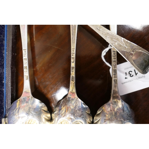 137 - Cased set of four George III silver gilt 'berry' spoons, London 1771, later decoration, weight appro... 