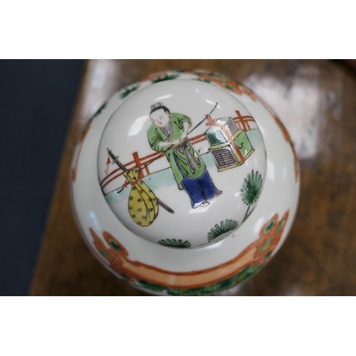 18 - Chinese famille verte covered jar, in Kangxi style, ovoid form decorated with figures within a fence... 