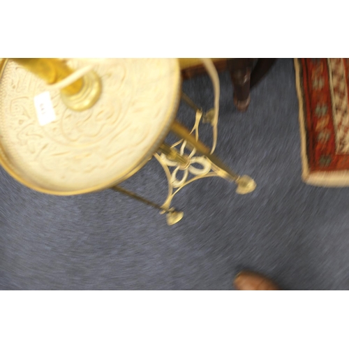 643 - Edwardian brass extending standard lamp, centred with a galleried circular tray detailed with Islami... 