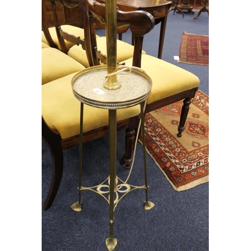 643 - Edwardian brass extending standard lamp, centred with a galleried circular tray detailed with Islami... 