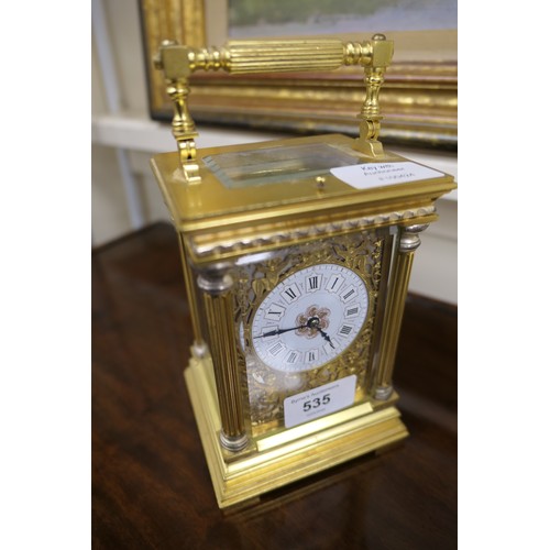 535 - Brass repeating carriage clock, having a printed dial with Roman numerals, within brass fretted surr... 