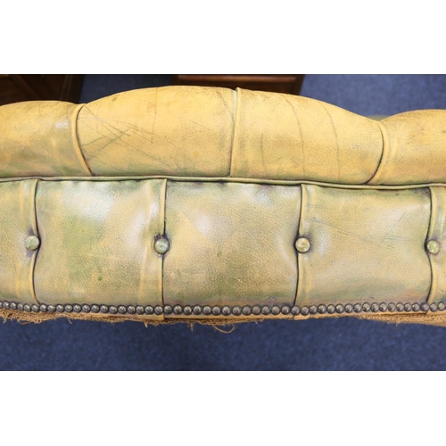 633 - Green deep buttoned leather upholstered chesterfield style settee, with a low back and  serpentine f... 