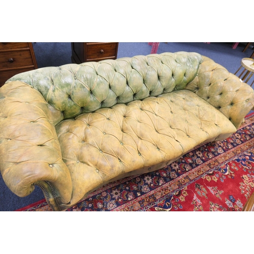 633 - Green deep buttoned leather upholstered chesterfield style settee, with a low back and  serpentine f... 