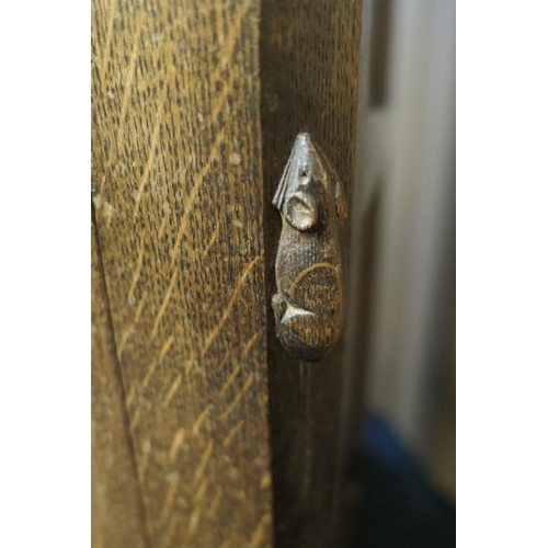 698 - Workshop of Robert 'Mouseman' Thompson, English oak dresser and plate rack, post 1971, the panelled ... 