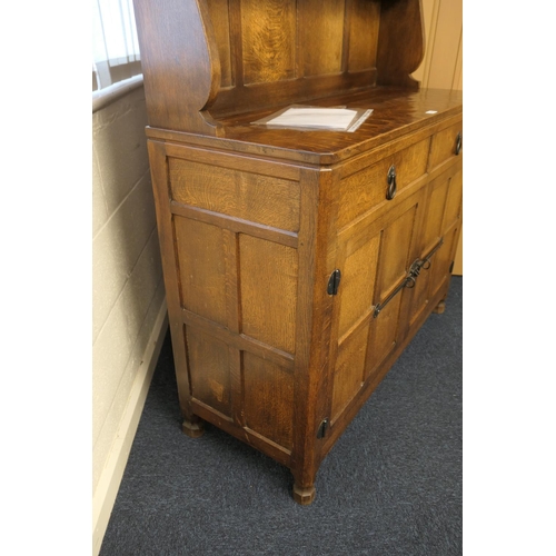 698 - Workshop of Robert 'Mouseman' Thompson, English oak dresser and plate rack, post 1971, the panelled ... 