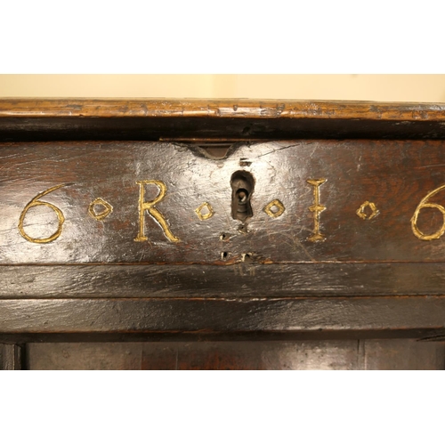 608 - Charles II oak joined coffer, dated 1662, the three recessed panel top over a front carved with '16 ... 