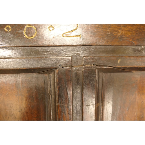 608 - Charles II oak joined coffer, dated 1662, the three recessed panel top over a front carved with '16 ... 