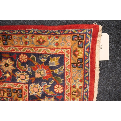 630 - Tabriz red ground woollen carpet, centred with a blue, red and fawn pendant medallion bordered with ... 