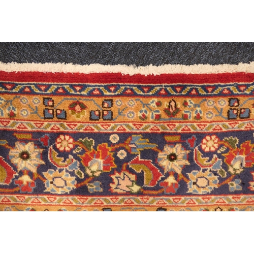 630 - Tabriz red ground woollen carpet, centred with a blue, red and fawn pendant medallion bordered with ... 