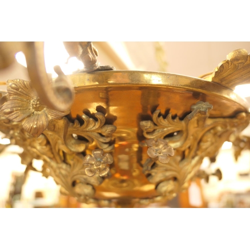 676 - French gilt brass ten branch chandelier, late 19th/early 20th Century, cast throughout with acanthus... 