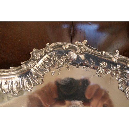 120 - French Rococo silver tray, circa 1810, irregular shaped form with raised border with rocaille and fo... 