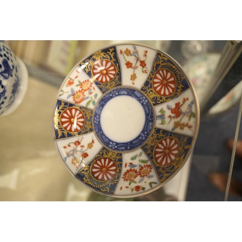 55 - Worcester cup and saucer in the Kakiemon palette, circa 1770, hatched blue square mark