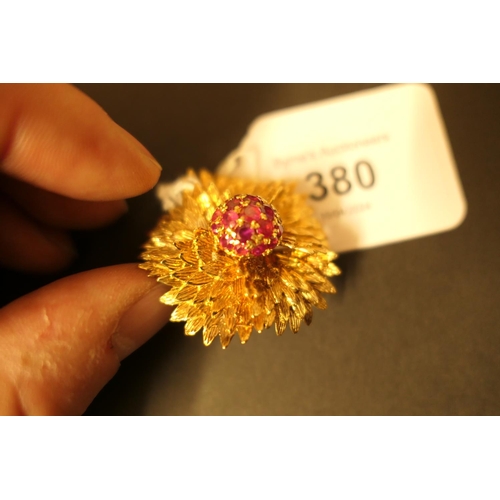 380 - 18ct gold and ruby chrysanthemum brooch, centred with a pistil of round cut rubies within a textured... 