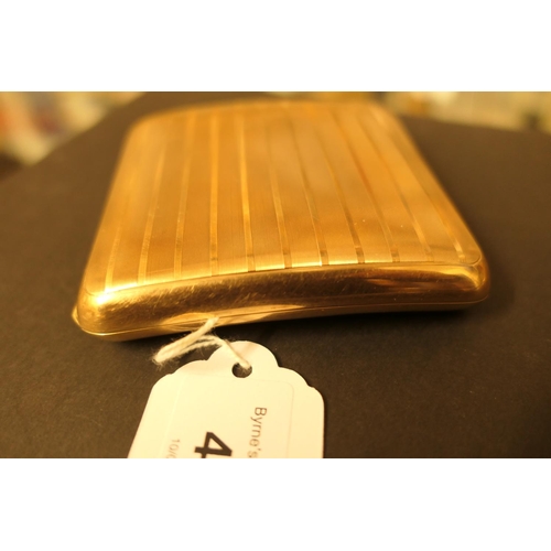 402 - George V 9ct gold cigarette case, London 1920, curved form with engine turned vertilinear decoration... 