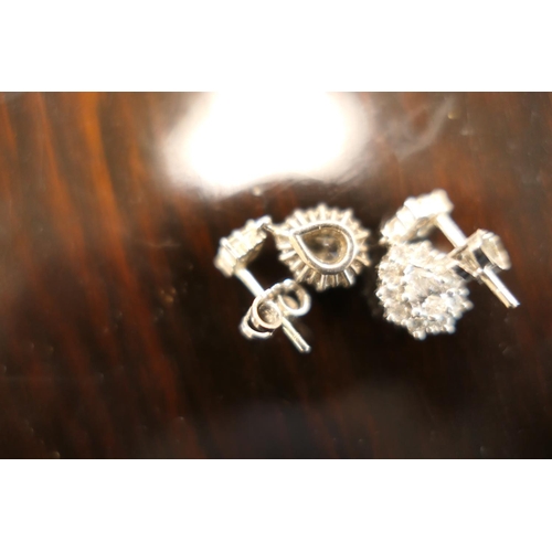 406 - Pair of diamond cluster pendant earrings, each centred with a pear cut diamond of approx. 0.5ct, est... 