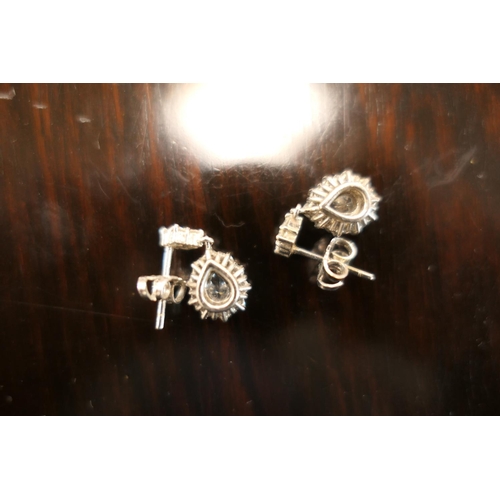 406 - Pair of diamond cluster pendant earrings, each centred with a pear cut diamond of approx. 0.5ct, est... 