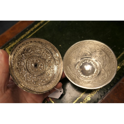 154 - Indian white metal covered bowl, chased with floral trails, over a small circular foot, 10.5cm diame... 