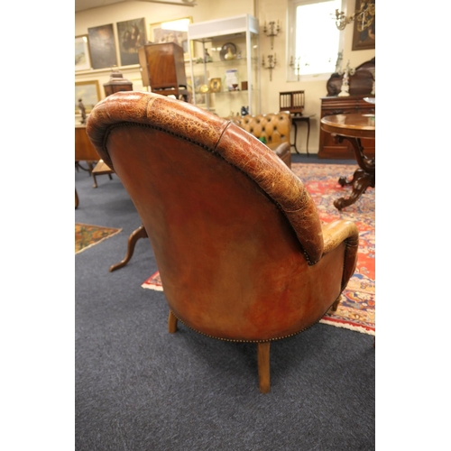 636 - Victorian style brown deep buttoned leather upholstered armchair, with rounded back and bowed seat f... 