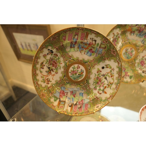 50 - Pair of Cantonese famille rose saucer dishes, late 19th Century, decorated in typical palette, 20.5c... 
