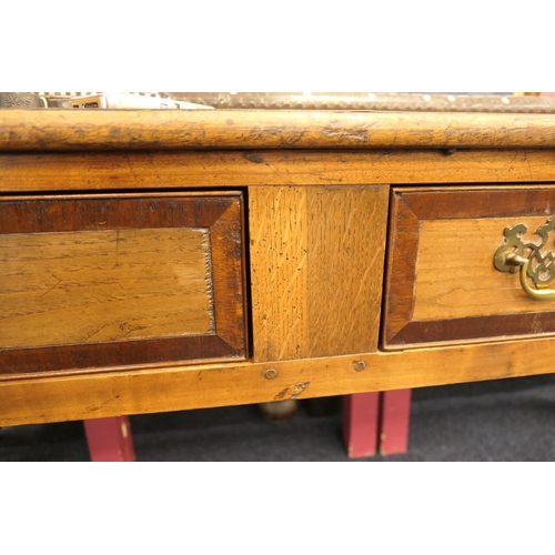 622 - Provincial fruitwood low dresser, 19th Century, the top crossbanded with mahogany and with three dra... 