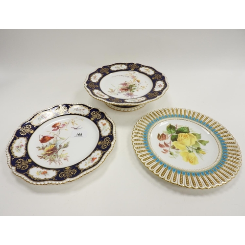 168 - Royal Worcester hand decorated short comport, 24cm diameter; also a matching plate with a differing ... 