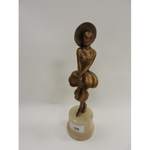 188 - In the style of Josef Lorenzl, an Art Deco cold painted bronze figure of a girl holding an ostrich f... 