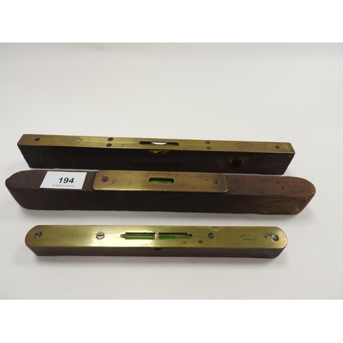 194 - W. Marples & Sons brass mounted wooden spirit level and two further brass mounted spirit levels (3)