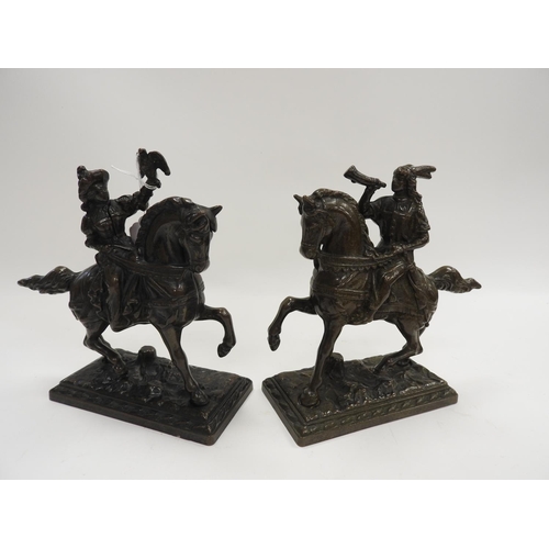 195 - Pair of continental cast brass hearth ornaments cast as Medieval hunters on horseback, height 19cm