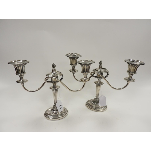 222 - Pair of Edwardian silver candelabra, Birmingham 1906, over a fluted column and oval base (loaded), w... 