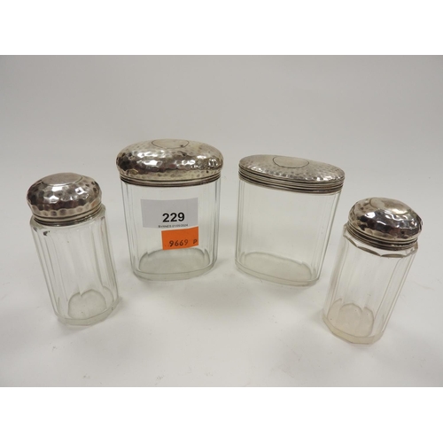 229 - Four silver mounted jars, gross silver weight approx. 72g