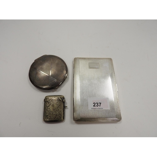 237 - Silver circular compact, Birmingham 1935; also a silver plated rectangular cigarette case and a silv... 