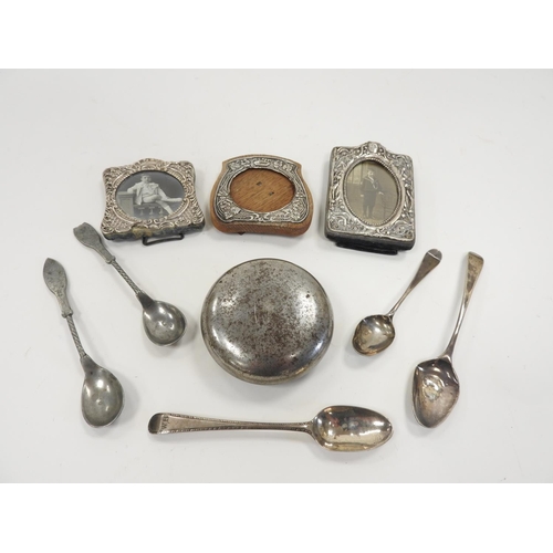 256 - Three small silver faced photograph frames, three Georgian silver teaspoons and two pewter spoons; a... 