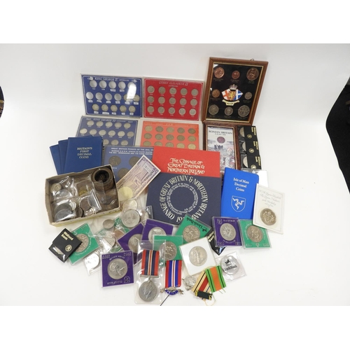 375 - Assortment of coins including a royal commemorative crowns, coin packs, loose bronze and copper coin... 