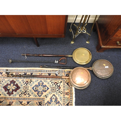 403 - Two Victorian copper warming pans, brass warming pan, two shooting sticks (5)