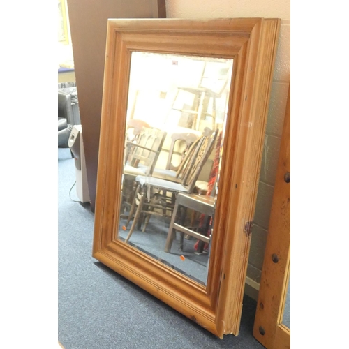 688 - Large pine moulded frame bevelled glass wall mirror, 138cm x 106cm