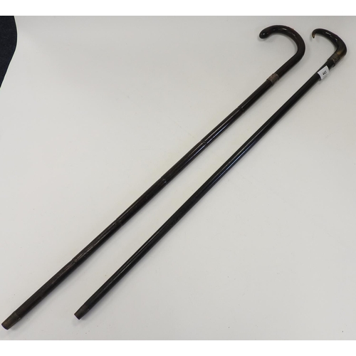 443 - Two silver mounted walking canes