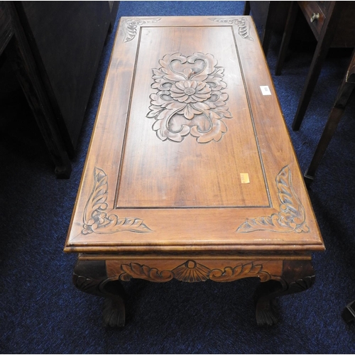 555 - Singapore floral carved coffee table, length 88cm