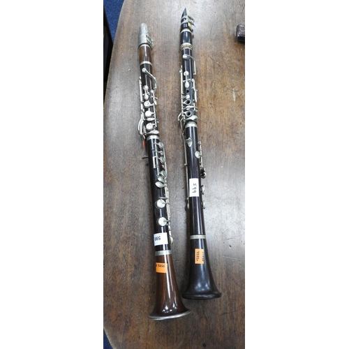 599 - Boosey & Co., London ebony and nickel sterling clarinet and a further unnamed clarinet (2)