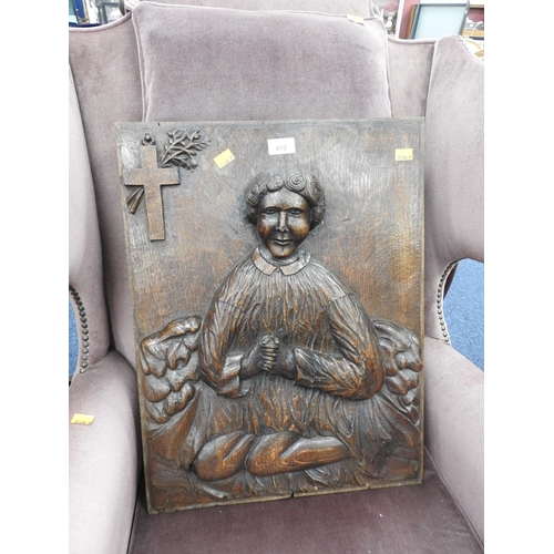 613 - Oak panel carved in bas relief with a devotional figure, 58cm x 44cm