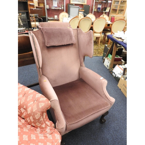 614 - Fabric upholstered wing armchair on claw and ball feet