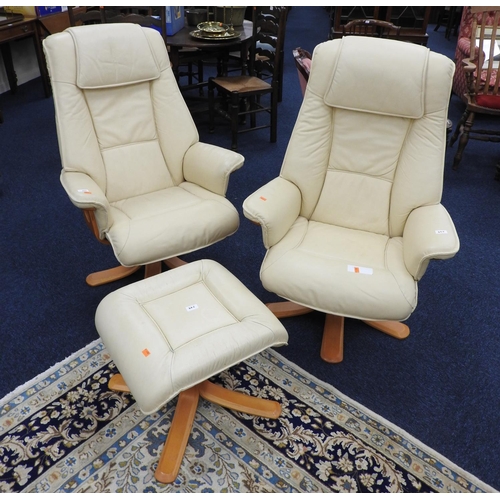 665 - Pair of cream leather upholstered swivel armchairs and one matching footstool