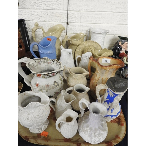 19 - Number of Victorian relief moulded stoneware jugs, also Samuel Alcock china jug and a Copeland & Gar... 