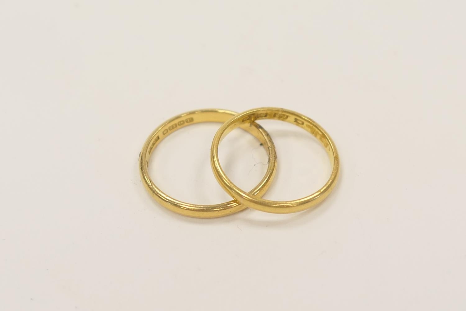 22ct gold wedding ring, ring size R, and a further 22ct gold wedding ...