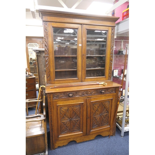 713 - Late Victorian Flemish carved oak library bookcase, width 129cm, height 207cm