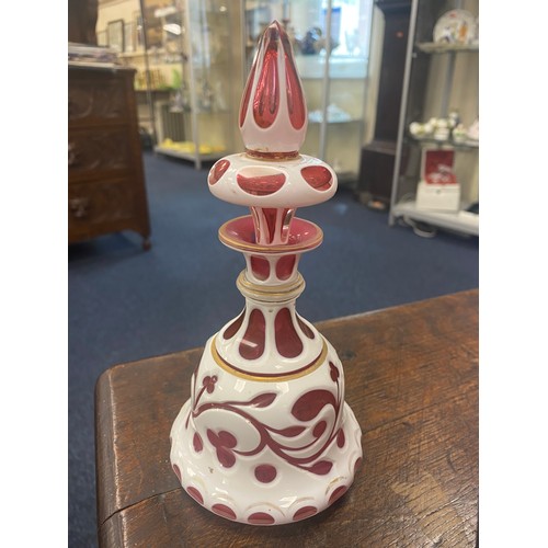 163A - Bohemian cranberry and white overlay glass scent bottle, height 19cm; also a blue overlay glass vase... 