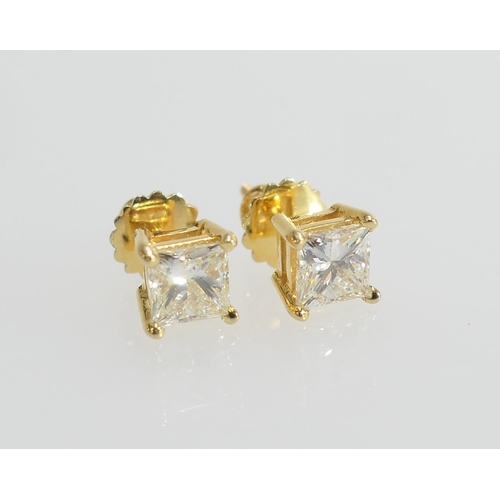 105 - Pair of diamond ear studs, the princess cut stones totalling approx. 2.3cts, colour N/O, SI1 clarity... 