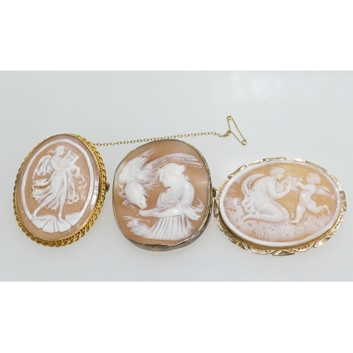 112 - Two 9ct gold mounted cameo brooches, the largest 43mm x 33mm; also another in an unmarked yellow met... 